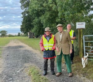 Three older men called Dave in a field.